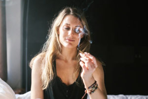 vibe by california dispensary things to expect when youre a first time cannabis user woman smoking blunt for first time